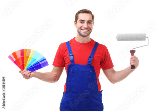 Young decorator holding col...