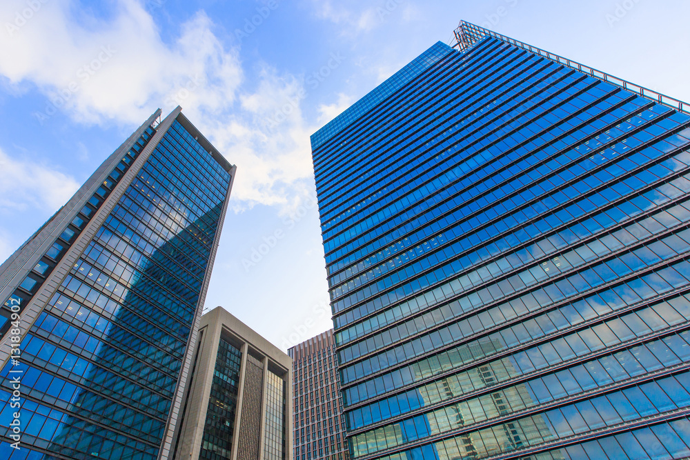 Tokyo office building bottom view with Blue sky