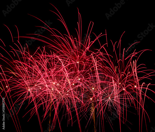 Red fireworks on black background at international competition i