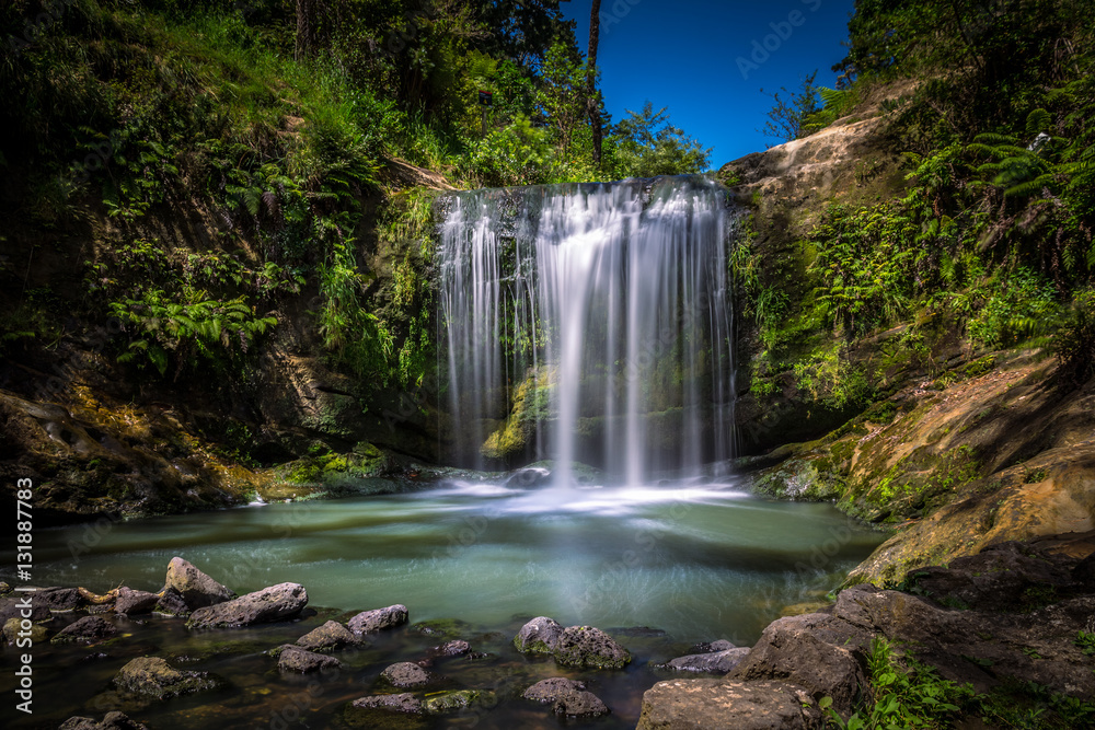 Long Exposure of Oakley Creek Waterfall on a bright Summers Day, Auckland, New Zealand