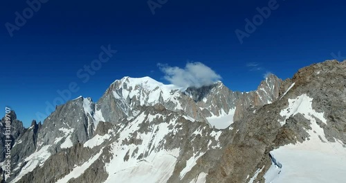 Panoramic view of Western alps whith Mount Blanc and Giant's Tooth (Dent du Geant) from Helbronner roof of europe in Aosta Valley region of Italy