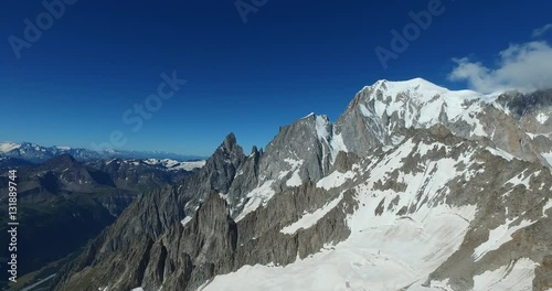 Panoramic view of Western alps whith Mount Blanc and Giant's Tooth (Dent du Geant) from Helbronner roof of europe in Aosta Valley region of Italy