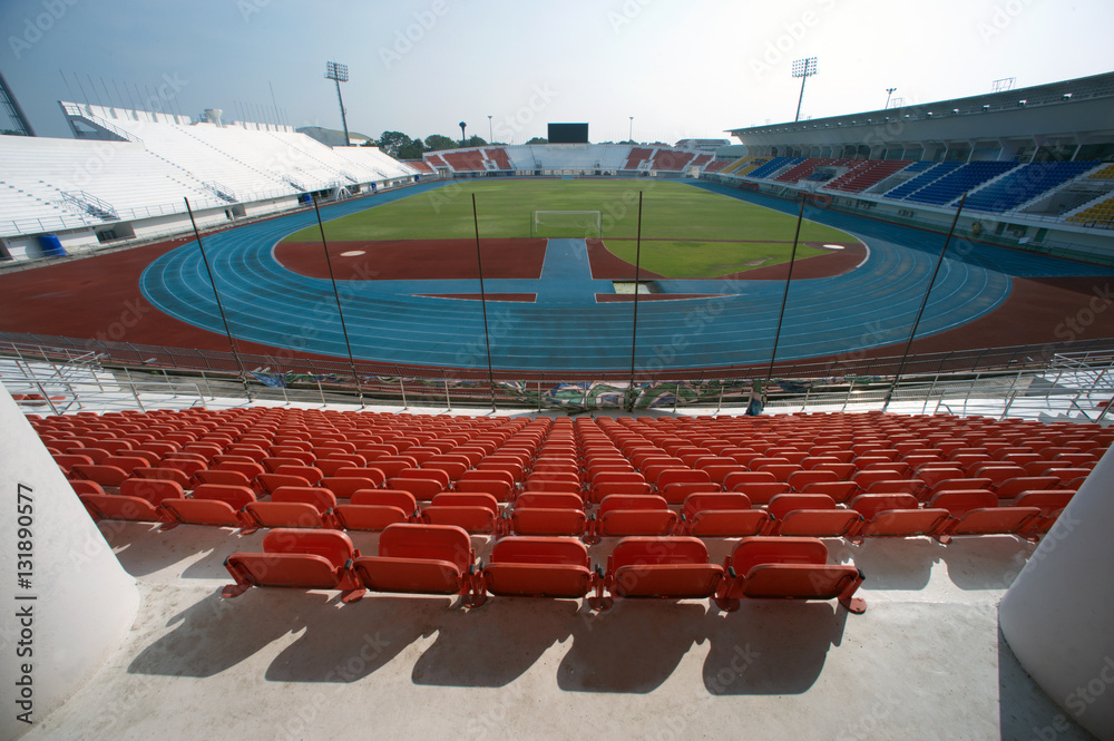 Fototapeta premium Colorful of stadium seats in background.