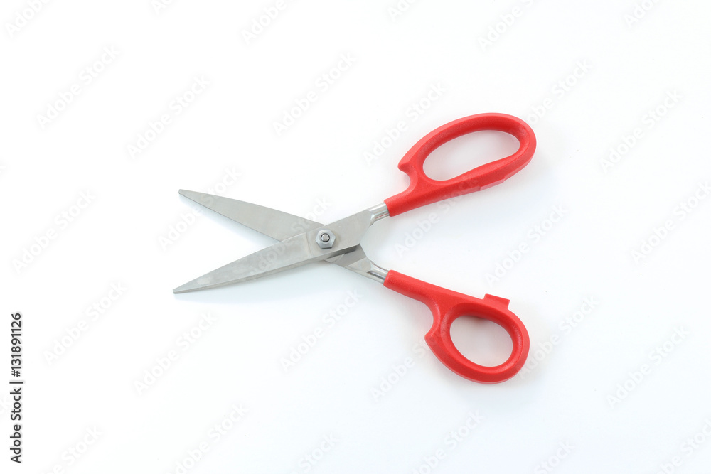 Red handle scissors in the open position, isolated on white
Red handle scissors in the open position, isolated on white