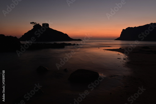 Portelet Bay  Jersey  U.K.  Wide angle image on the beach with a Winter sunset using a long exposure.