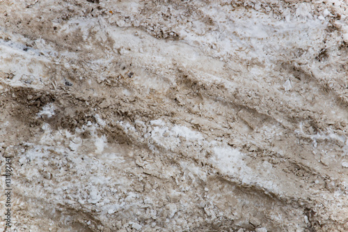 Snow and slush footprints on the road © nellino7