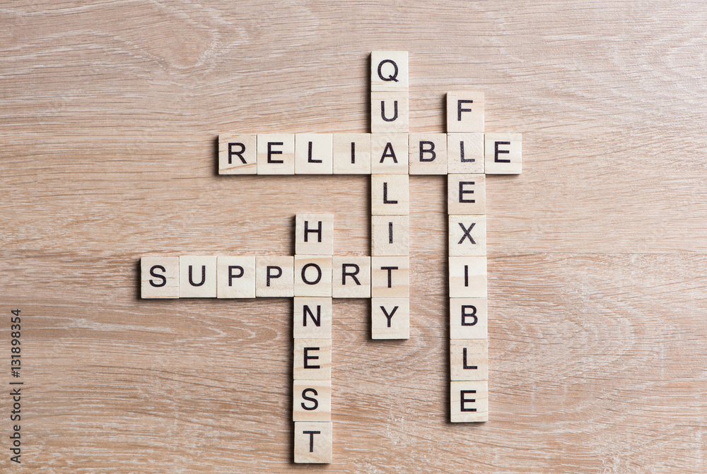 Conceptual business keywords on table with elements of game making crossword Conceptual business keywords on table with elements of game making crossword