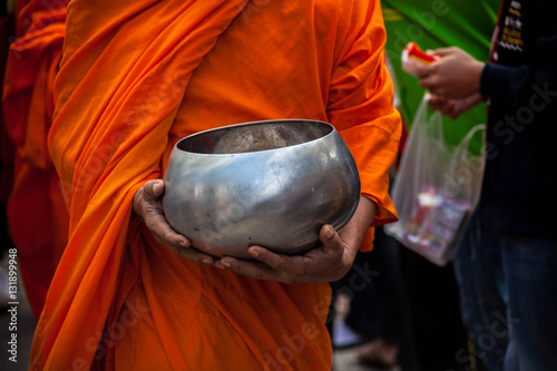 Buddhist merit. monk s alms bowl photo