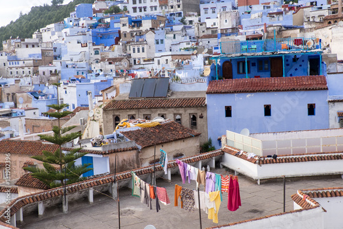Fototapeta Naklejka Na Ścianę i Meble -  Africa,North Africa,Morocco, Chefchaouen or Chaouen  is most  noted for its small narrow streets and neighborhoods painted in  variety of vivid blue colors. Clothes drying on line.