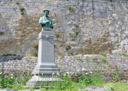 Bronze buste of french impressionist painter Charles-Francois Daubigny in Auvers-sur-Oise near Paris, France photo