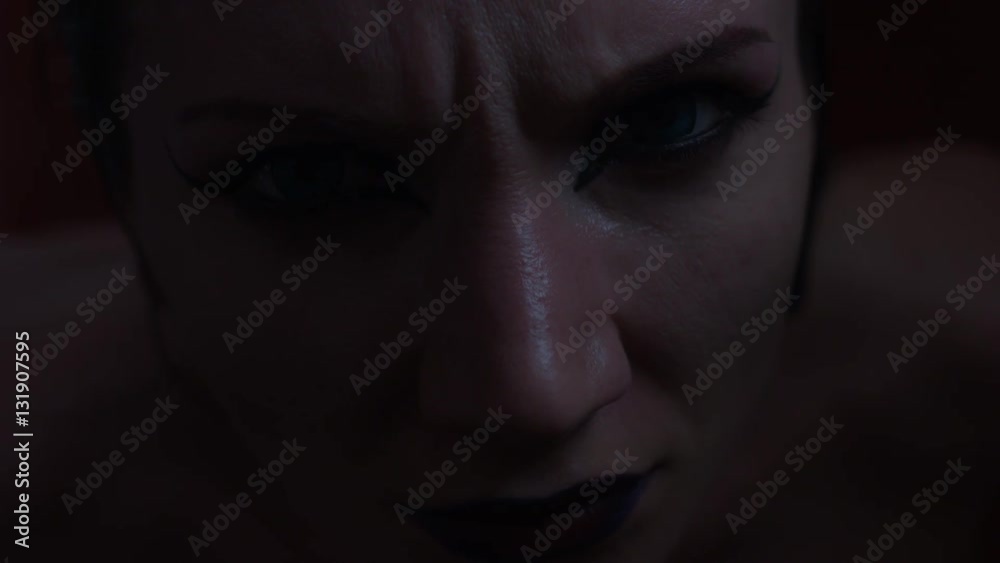 4k shoot of a horror Halloween model - Vampire looking evil with flashing light 4k shoot of a horror Halloween model - Vampire looking evil with flashing light