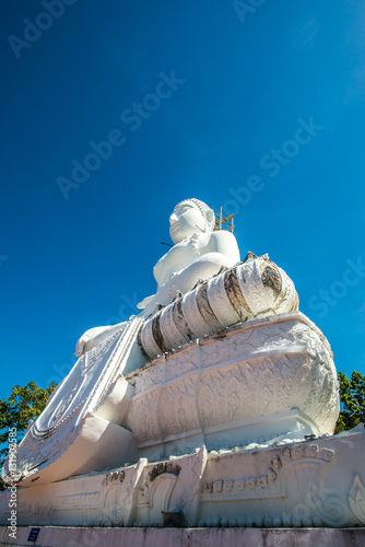 White buddha statue under construction at Phra That Maeyen templ photo