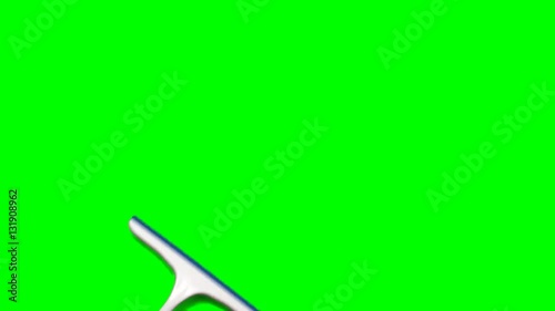 Male hand swiping squeegee across green screen