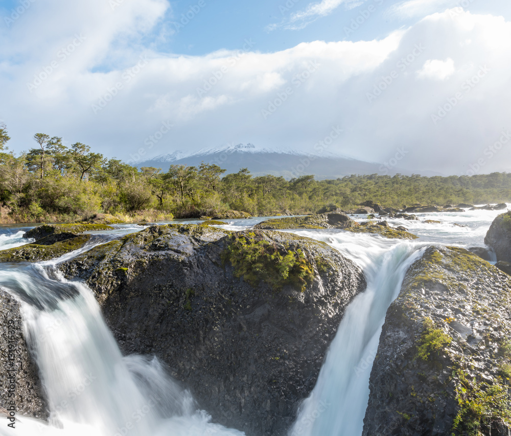 Petrohue Falls and Osorno Volcano with its snowy peak near Puerto Varas, Chile Petrohue Falls and Osorno Volcano with its snowy peak near Puerto Varas, Chile