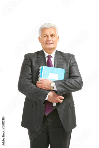 Senior man with notebook on white background © Africa Studio