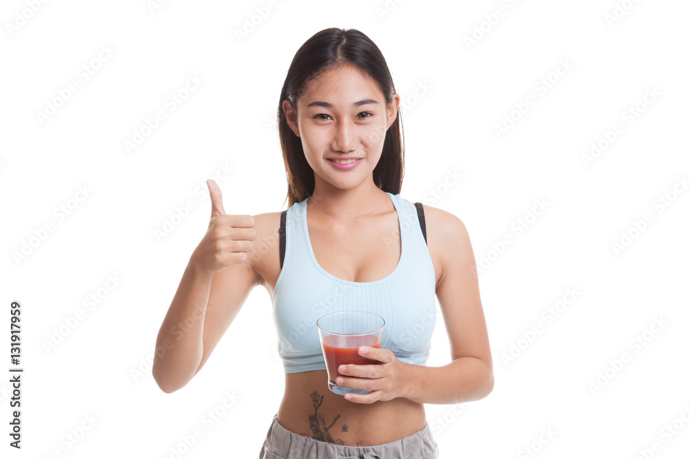 Beautiful healthy Asian girl thumbs up with tomato juice. Beautiful healthy Asian girl thumbs up with tomato juice.
