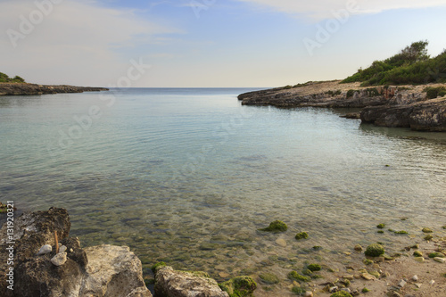 Salento coast: Porto Selvaggio Bay.ITALY (Apulia).Unspoiled nature with a small beach of sand and pebbles, surrounded by a rocky coastline.