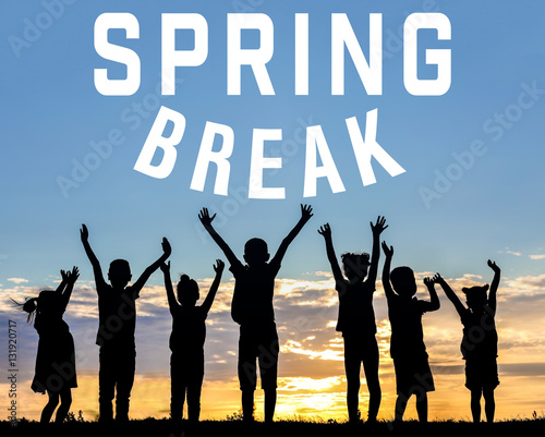 Text SPRING BREAK and children silhouettes on sunset background. Additional education concept