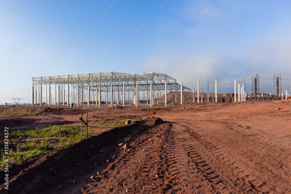 Construction Building Structure frame halfway for large factory warehouse . Construction Building Structure frame halfway for large factory warehouse .