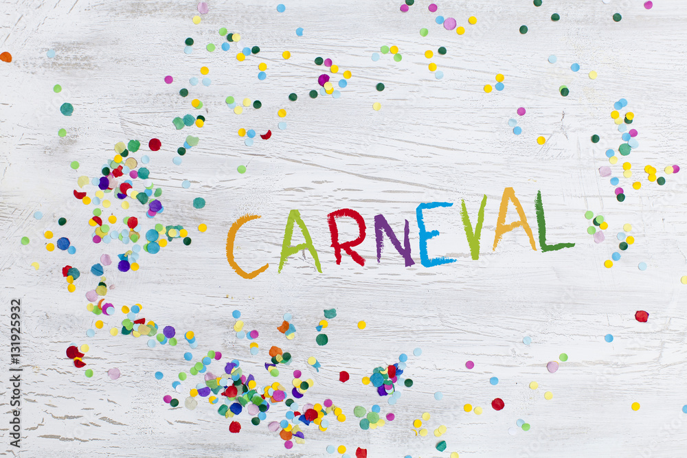 carnival confetti on wood background carnival confetti on wood background