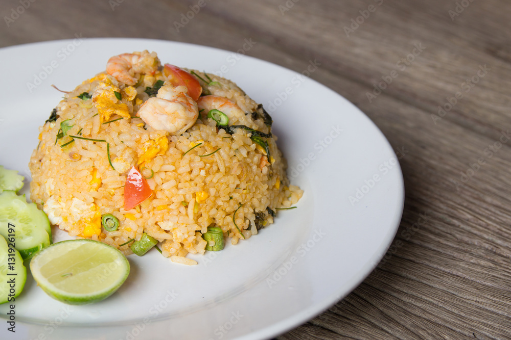 Shrimp fried rice on wood floor