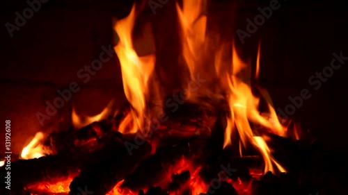 A fire burns in a fireplace