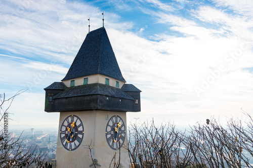 Grazer Uhrturm an einem nebeligen Wintertag photo