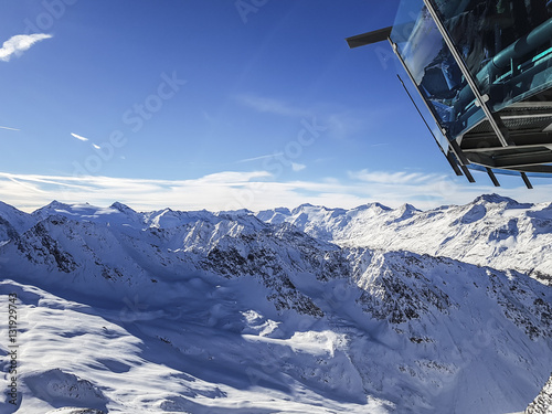 Sky Restaurant overlooking on Alps mountains covered with winter snow, Austria, © donvictori0