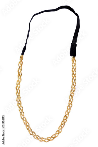 Golden metallic headband made of multiple weaved golden fibers with a black textile elastic band, fashion item isolated on white background