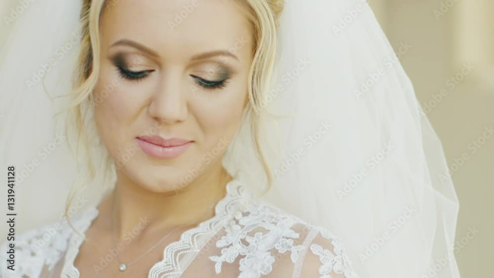 Portrait of a young blond Caucasian bride. Smiling, looking at the camera Portrait of a young blond Caucasian bride. Smiling, looking at the camera