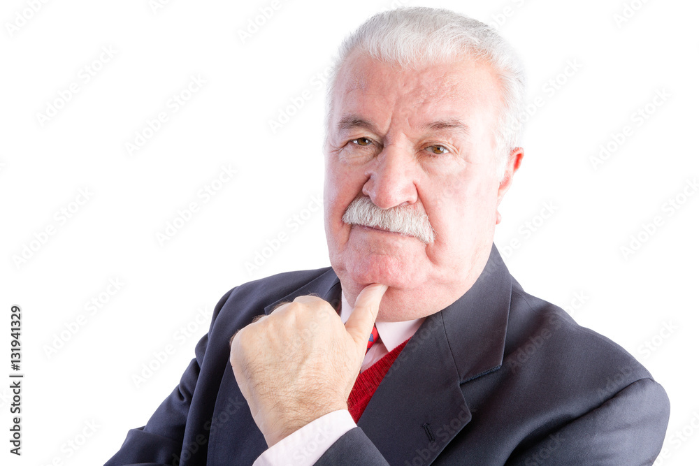 Elderly businessman resting chin on hand Elderly businessman resting chin on hand