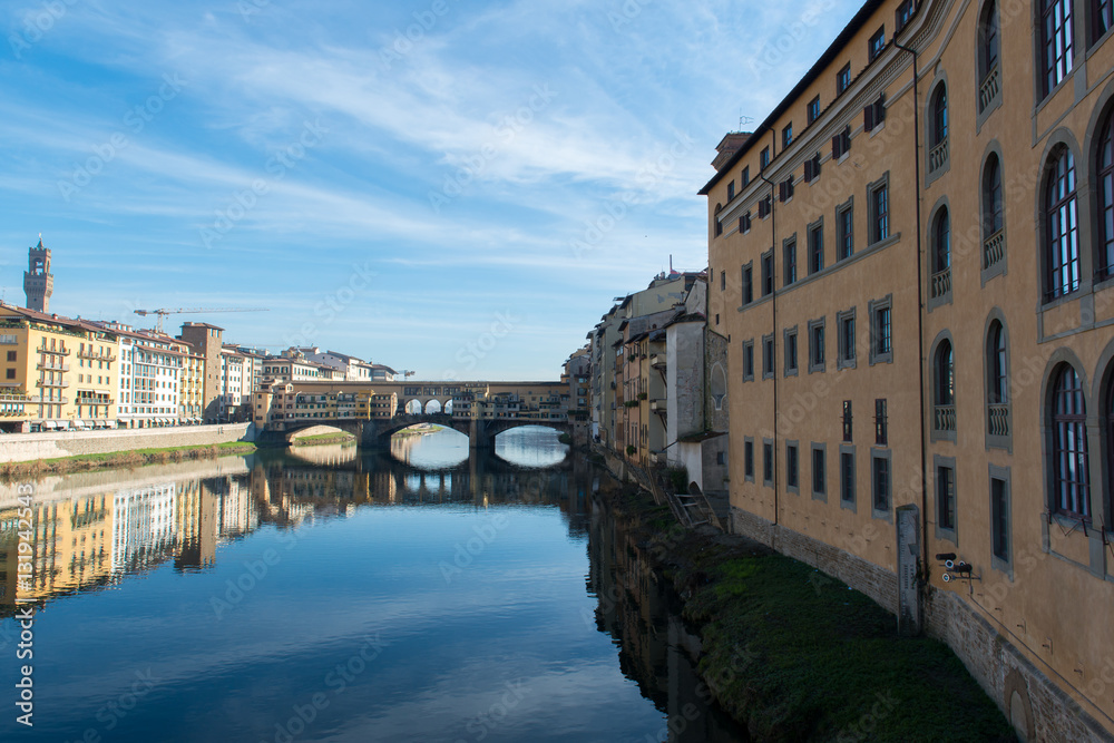 View of Arno river embankment with architecture and Ponte Vecchi