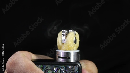 showing burn of juice or liquid in the coil, wire and cotton inside the atomizer of electronic cigarette for vaping, close up scene, high definition, Full HD, 1920x1080