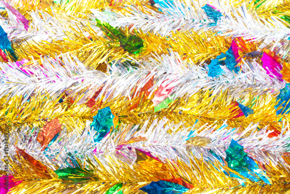 Silver tinsel and Gold tinsel with colorful leaves christmas tre