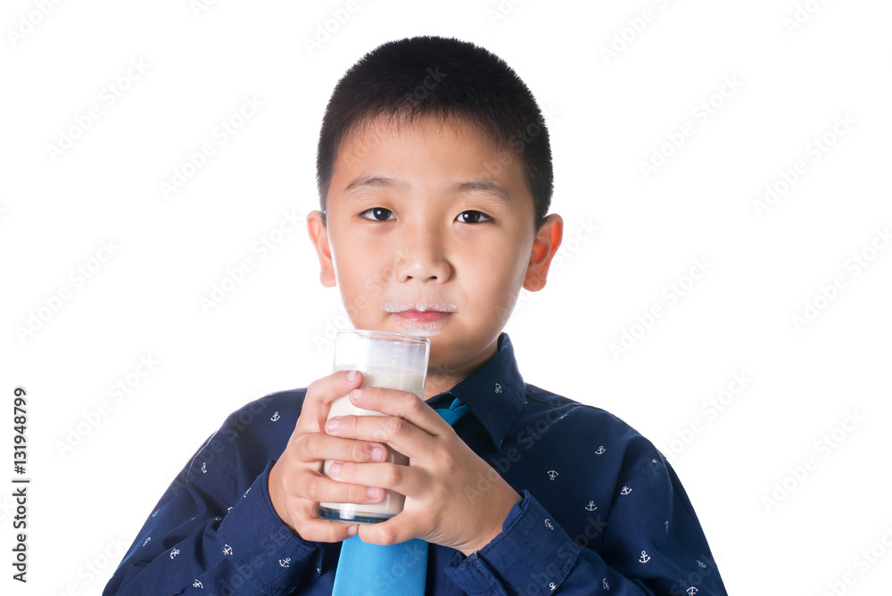 Boy drinking milk with milk mustache holding glass of milk isola Boy drinking milk with milk mustache holding glass of milk isola