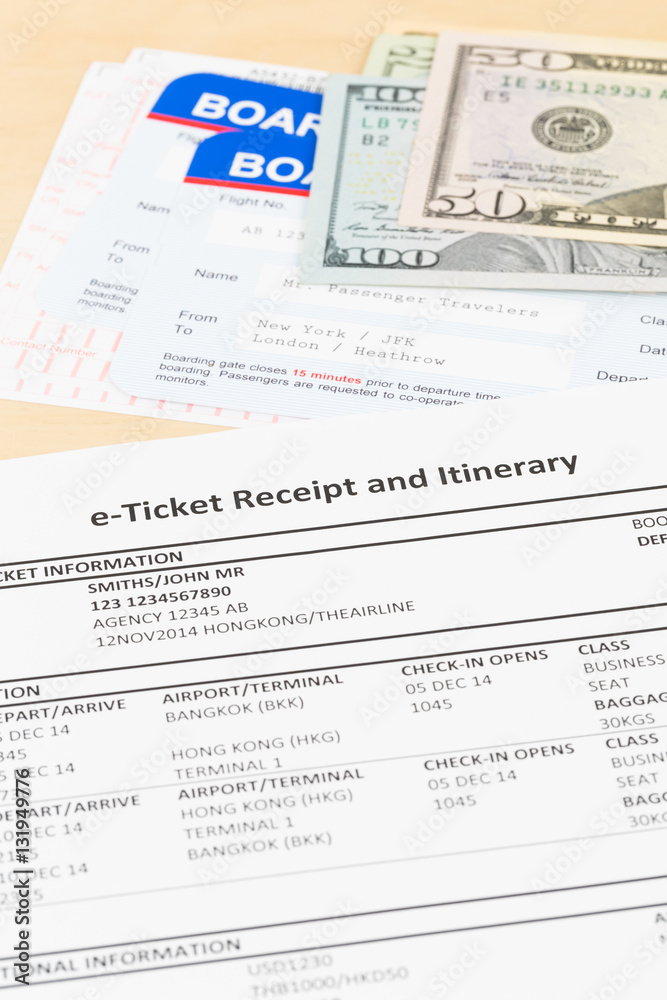 E-ticket, dollar money banknote, and boarding pass; these docum E-ticket, dollar money banknote, and boarding pass; these docum
