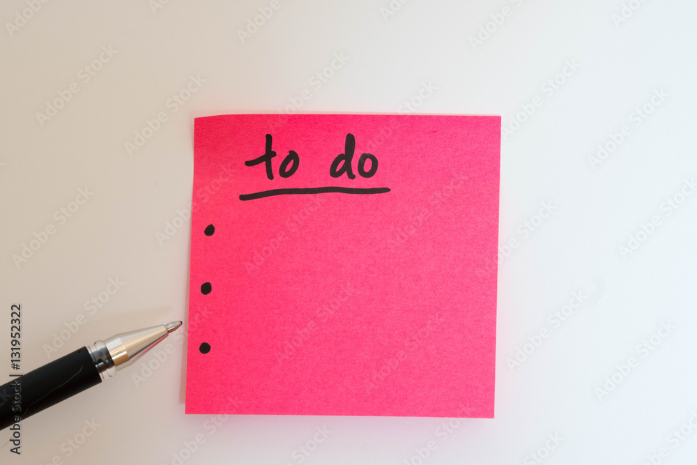 pink sticky note with to do list and a black pen pink sticky note with to do list and a black pen