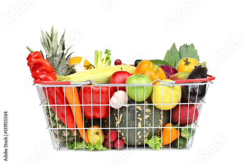 Fresh vegetables and fruits in basket on white background