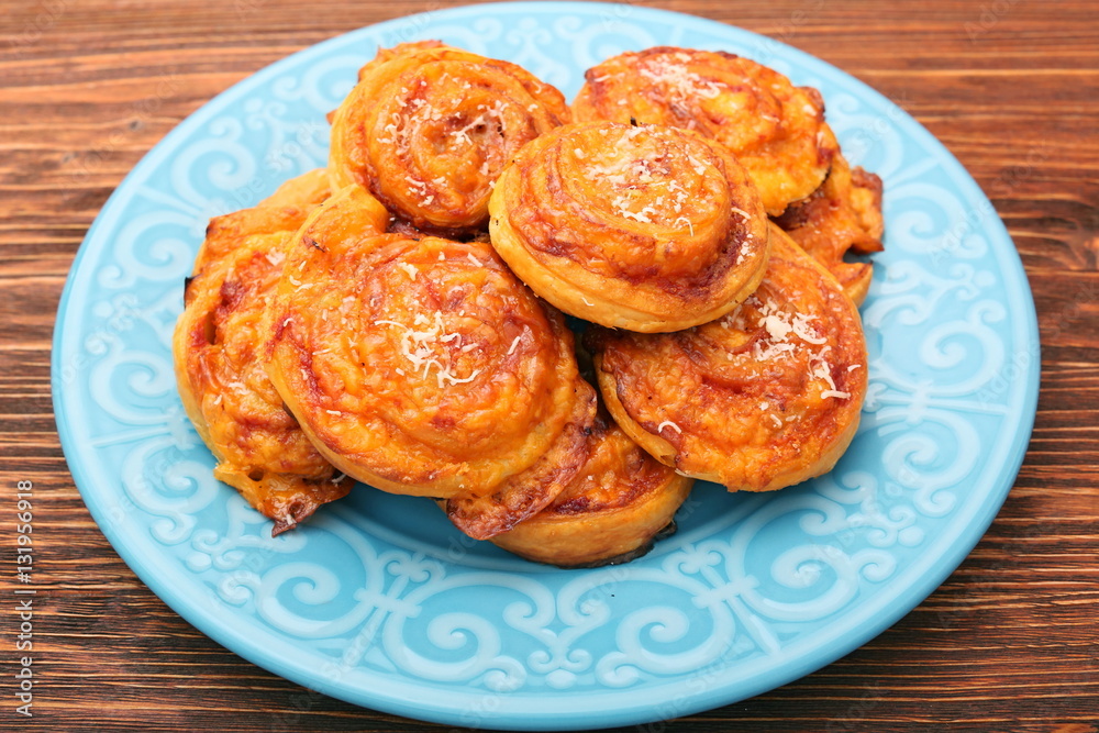 Puff pastry rolls with ham and cheese. Food for parties. Snack.