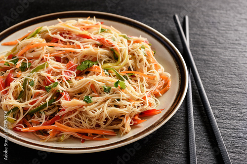 Asian salad with rice noodles and vegetables.