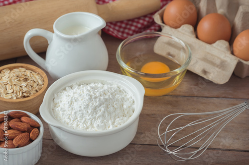 Baking ingredients flour  egg  milk  almonds  oat on table