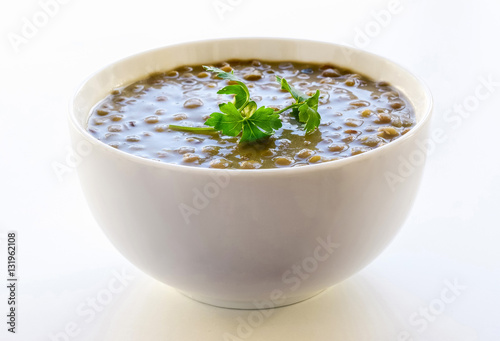 Lentil soup isolated on white background