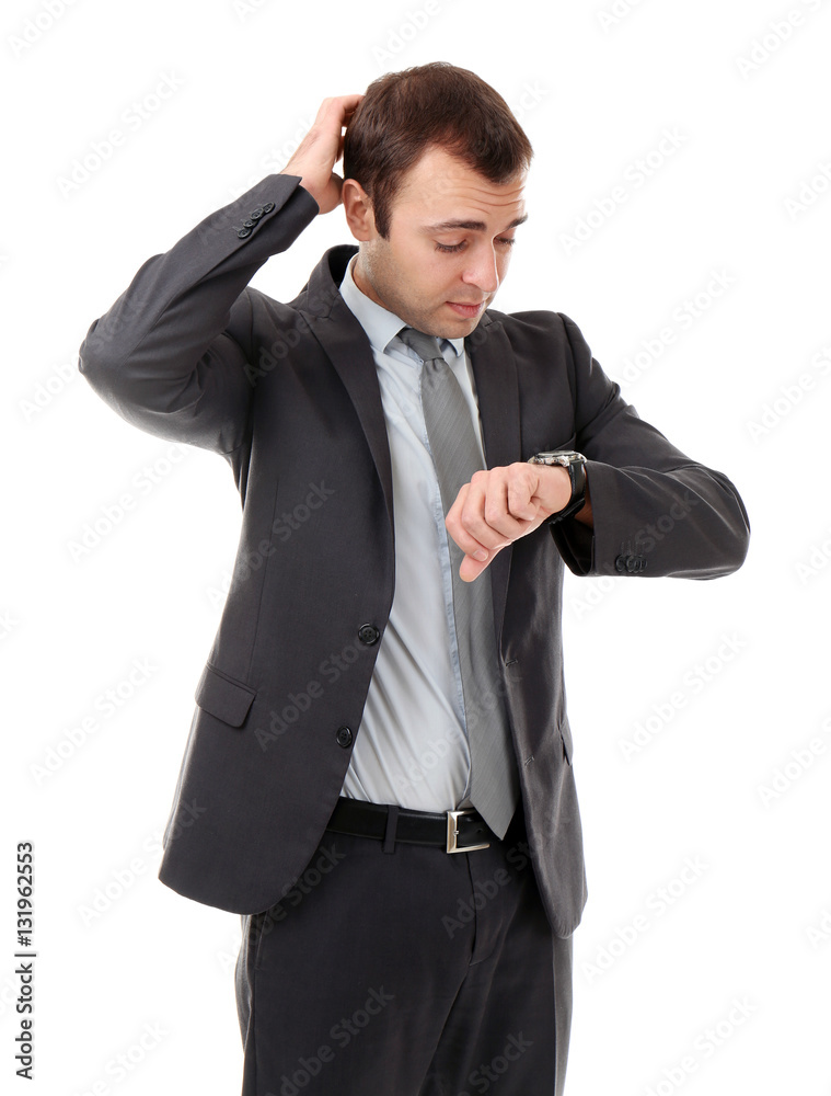 Handsome businessman looking at his watch, on white background Handsome businessman looking at his watch, on white background