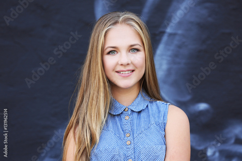 Pretty teenager girl standi...