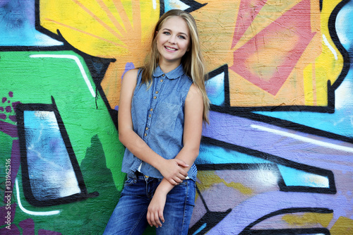 Pretty teenager girl standi...