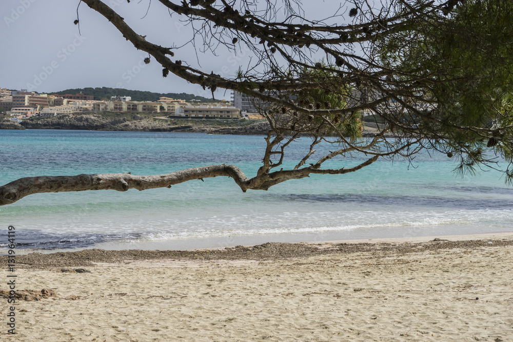 Rocks by the sea with waves of the Mediterranean sea next to the