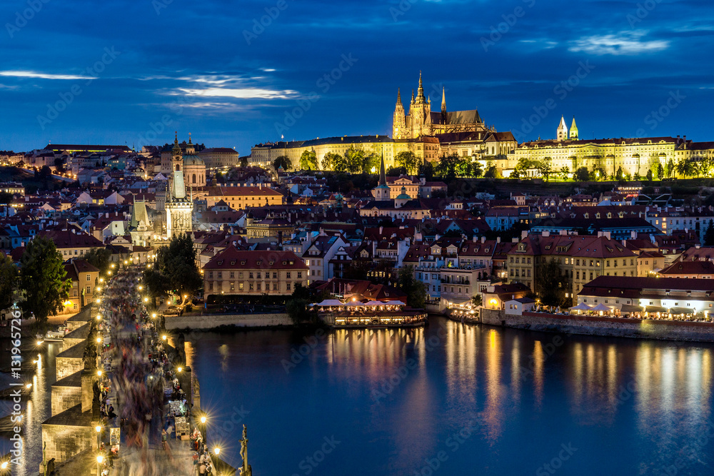 Panorama of Prague Castle and St. Vitus cathedral in twilight with dramatic sky. Prague, Czech Republic