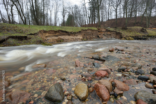 Fototapeta Naklejka Na Ścianę i Meble -  Natural erosion, shore of wild forest river