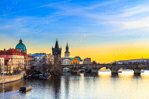 View of the Vltava River and Charles bridge shined with the sunset sun, Prague, the Czech Republic © daliu