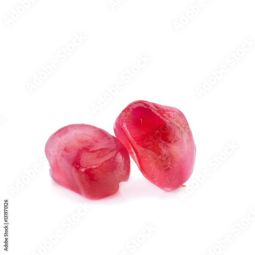 Ripe pomegranate fruit segment on white background.